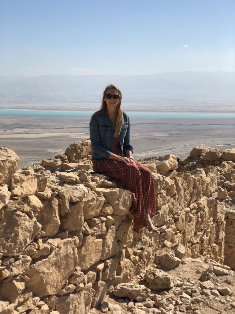 Brandi Didlott on a rocky cliffside