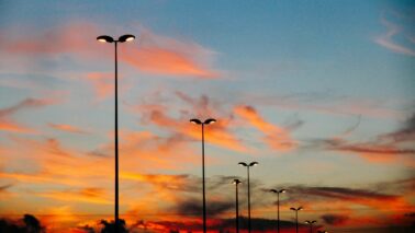 Parking lot lighting with sunset in the background