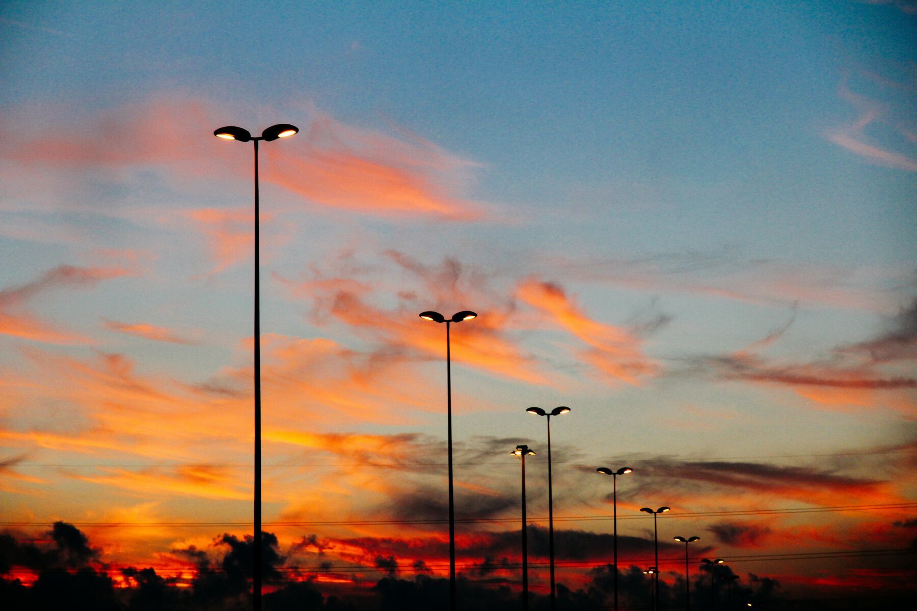 Parking lot lighting with sunset in the background