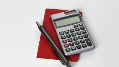 calculator and a pen - cost of an industrial generator