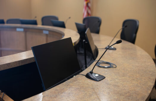 mic and computer screen in a township conference room