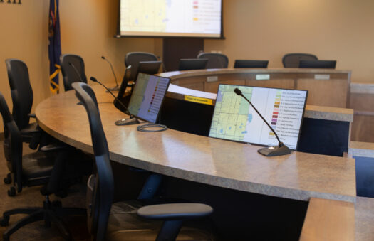 mic and computer screen in a township conference room