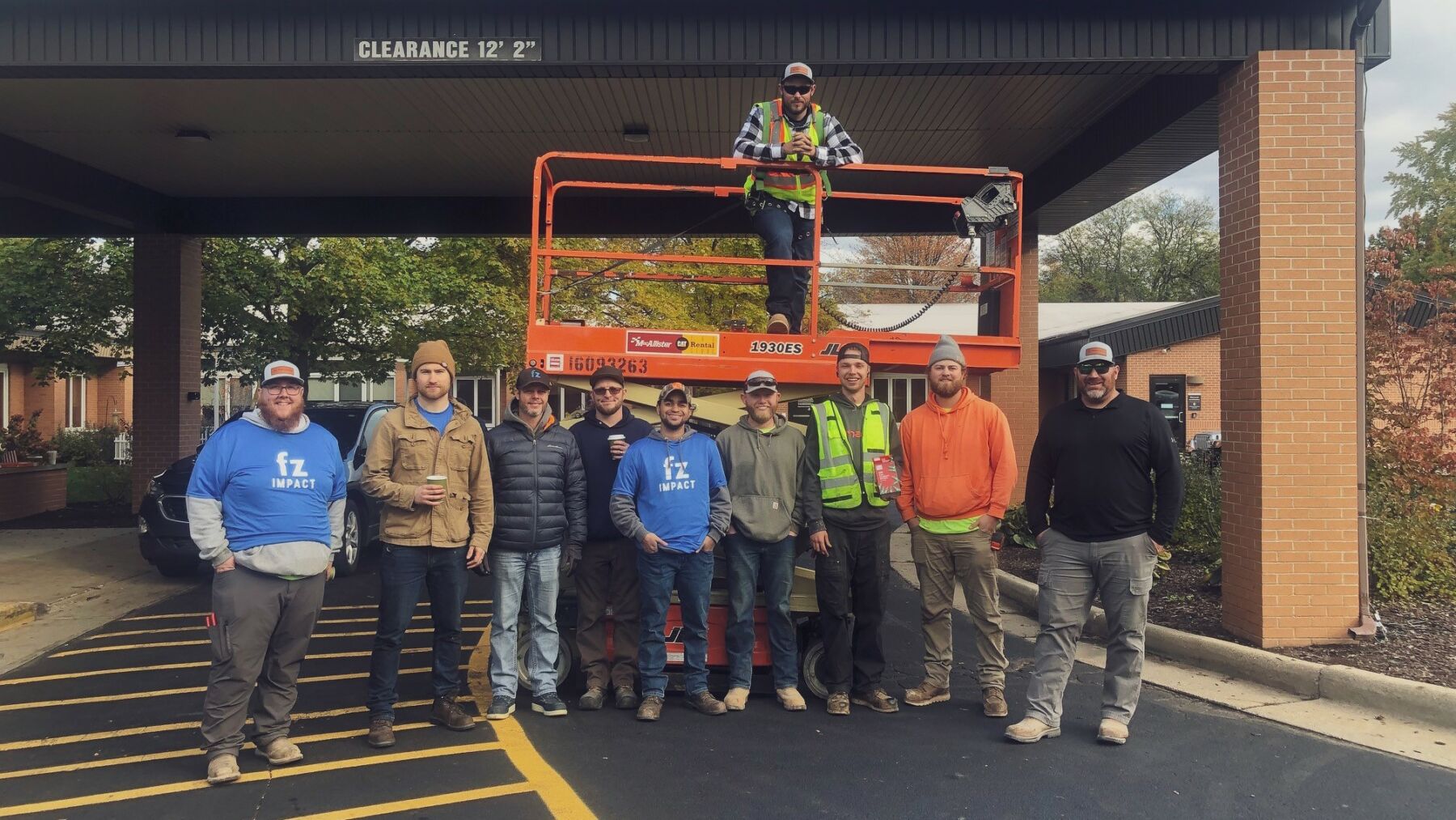 apprentices in front of lift