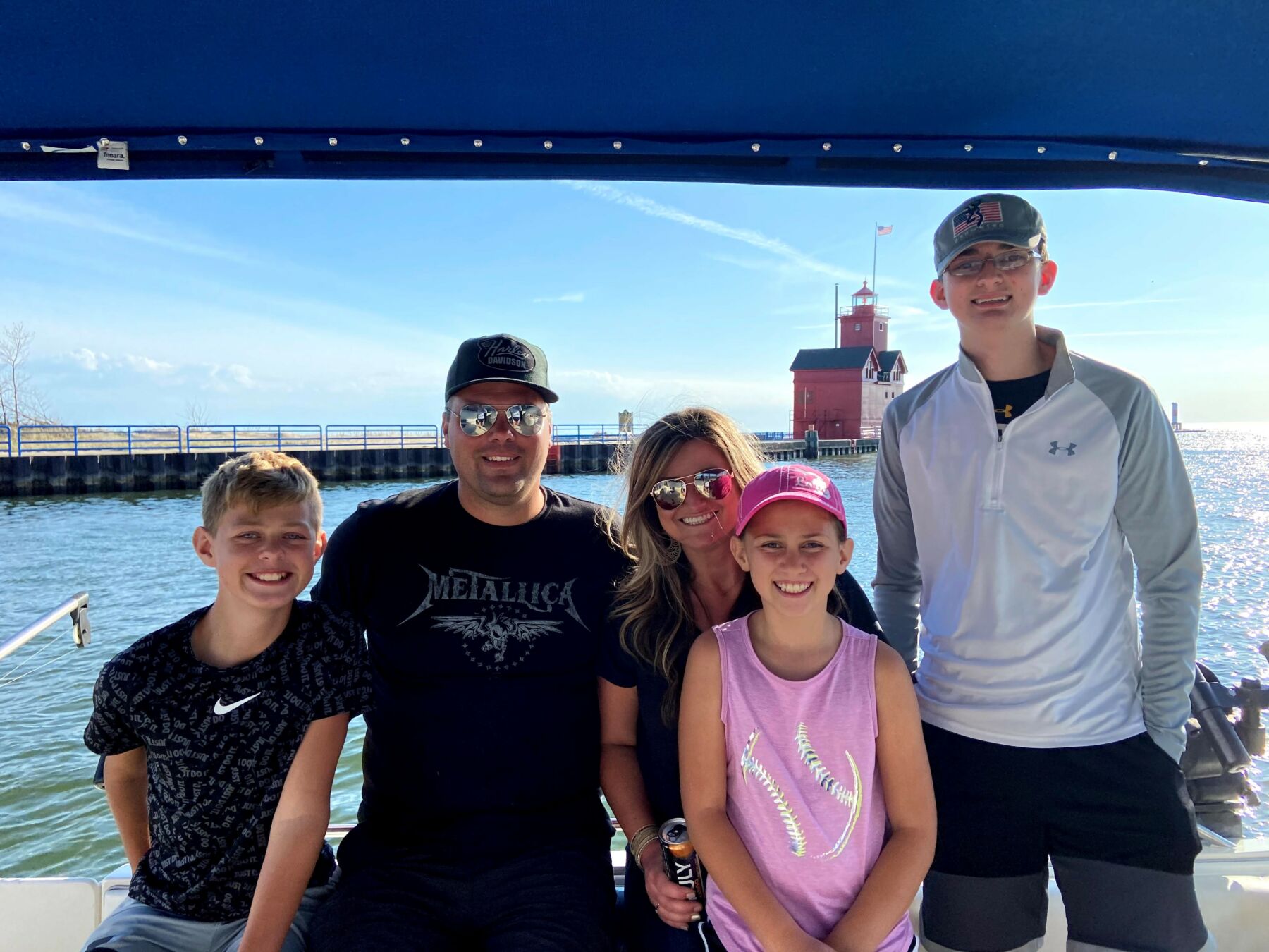 chris and family on a boat