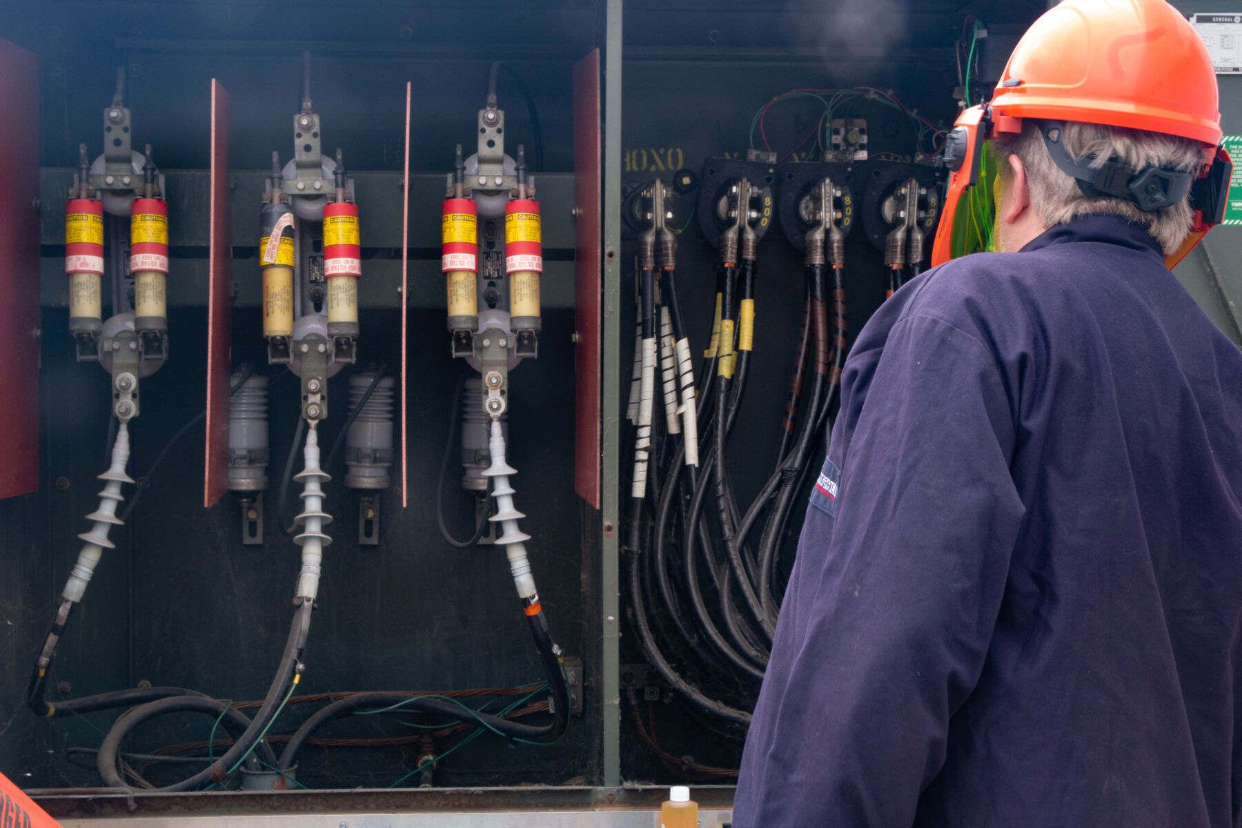 Technician inspecting a transformer