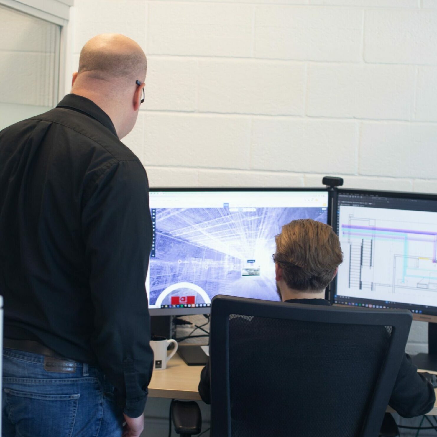 IMG_0156 - Square Electrical designers reviewing a scan-to-bim image on a computer
