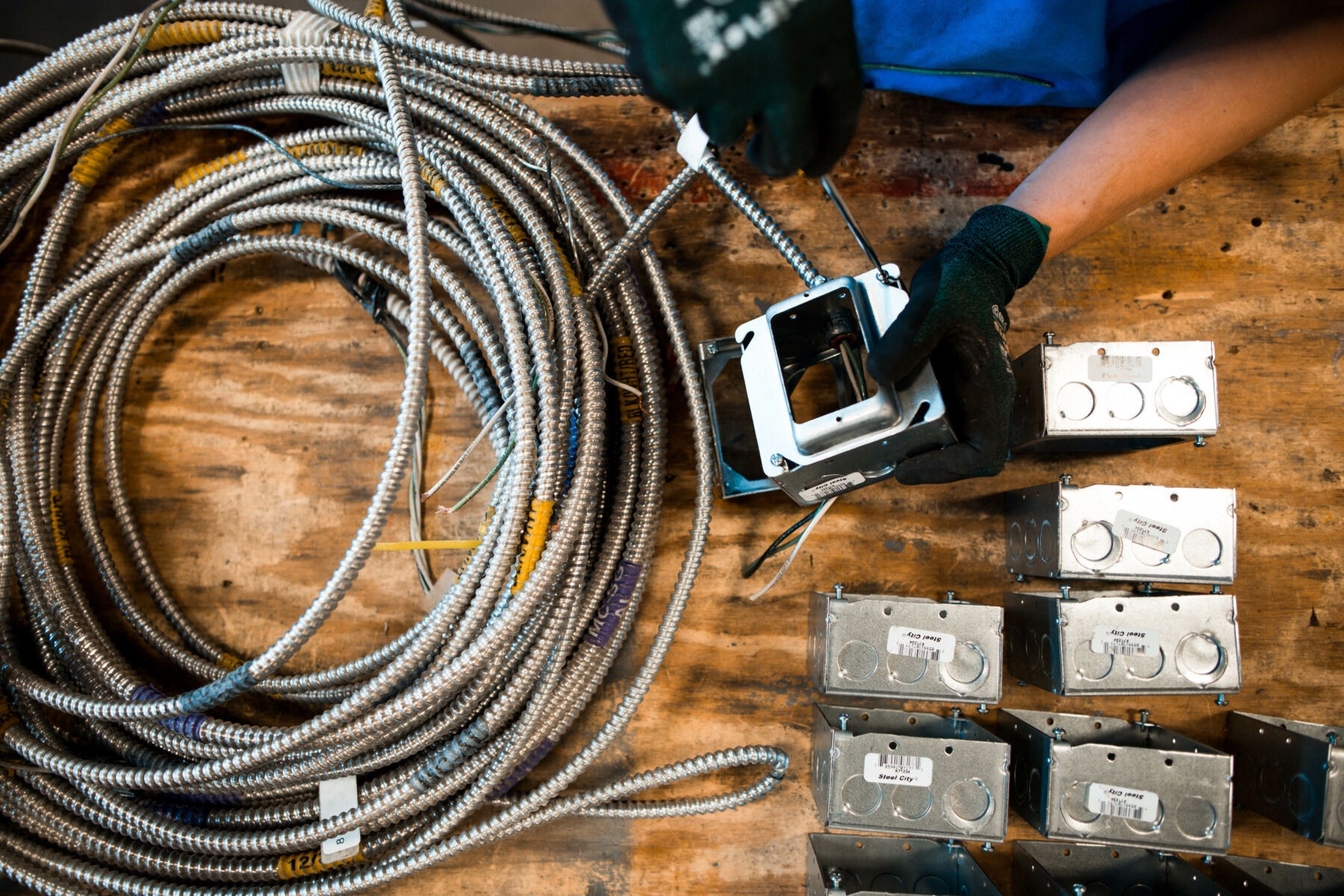 Fabrication 2 person working on a prefabricated electrical assembly