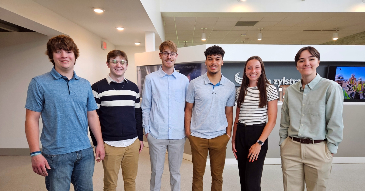 Aimee Zang, Evan Klein, Izaiah Marve, Cam Gavette, Skyler Dare, and KayeLee Martens standing lined up in a group photo.