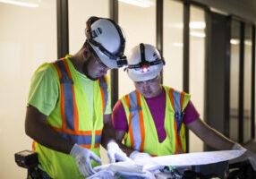 FZ electricians examining blue prints for Lifeway Christian Resources Building