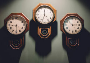 history of MES and IIoT Blog post - photo of three clocks